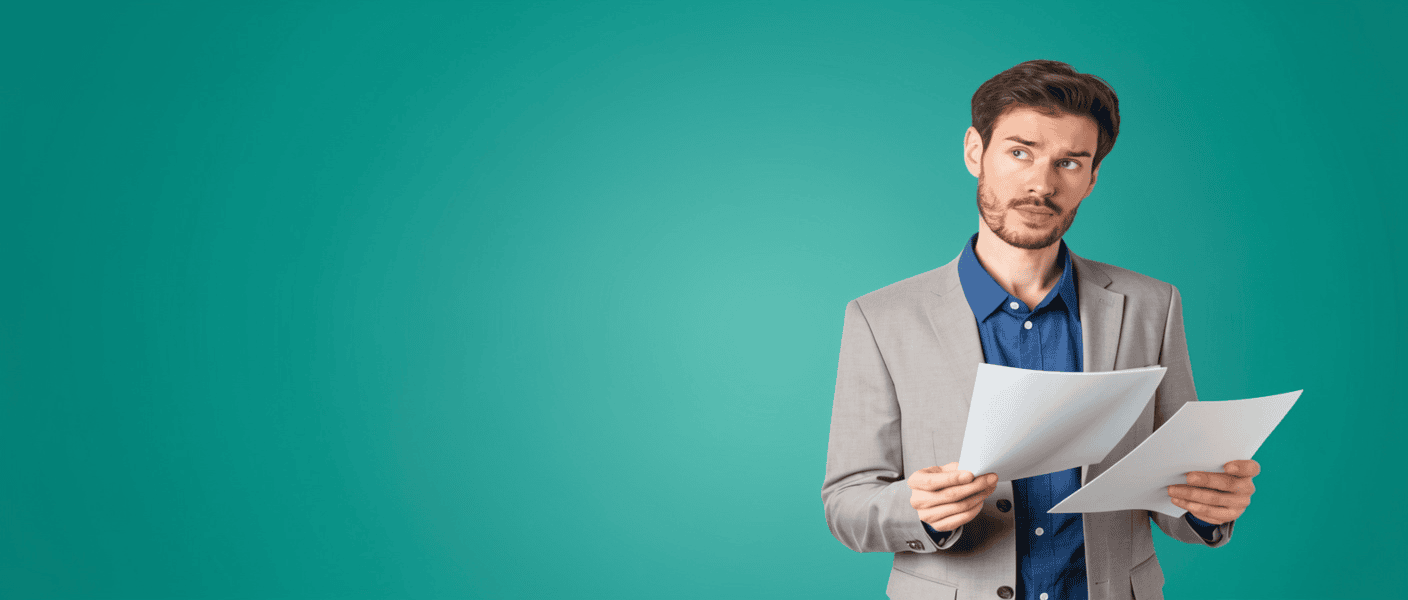 Man looking up from two documents